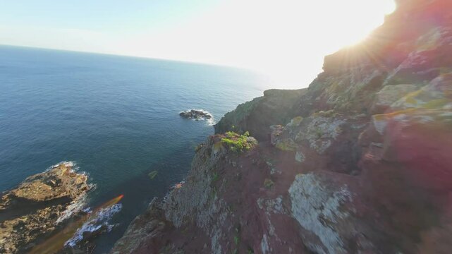 Aerial views of the rocky coastline made of cliffs and deep blue waters of Atlantic Ocean at Playa Nogales in La Palma, Canary Islands