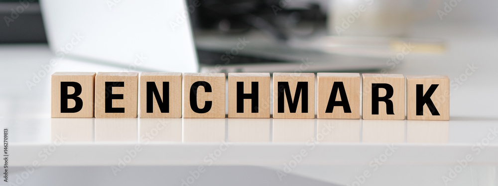 Poster a wooden block with the letters benchmark and m