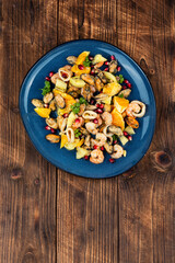 Spicy seafood salad with fruits.