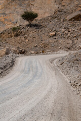 Oman, 03-06-2025: canyon and view of the winding road to Jebel Al Harim (Jabal Al Harim), the...