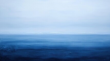 Fototapeta premium The sky and ocean blend together in various shades of blue, creating a tranquil and soothing scene at dawn. Soft hues reflect a peaceful morning vibe