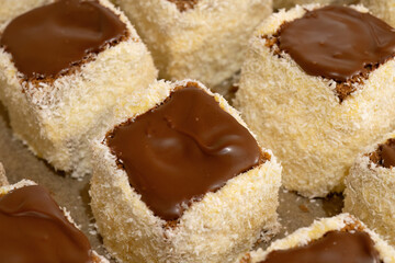 Traditional coconut sponge cakes with chocolate topping

