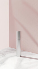 Minimalist silver bottle on a marble surface with soft shadows against a pink backdrop