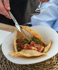 Fresh tuna ceviche starter on a crispy corn tortilla