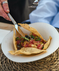 Fresh tuna ceviche starter on a crispy corn tortilla
