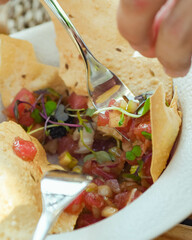 Fresh tuna ceviche starter on a crispy corn tortilla