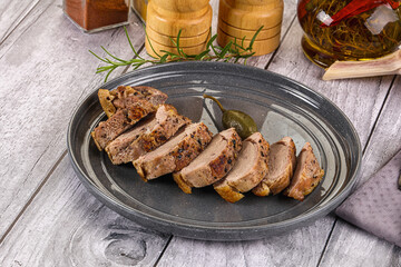 Roasted duck breast slices in the plate