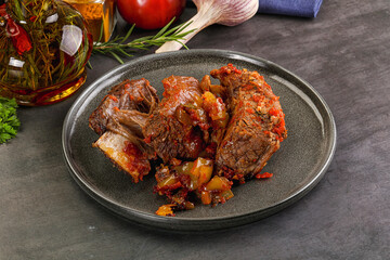 Baked beef ribs with vegetables