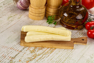 White mozzarella sticks over board