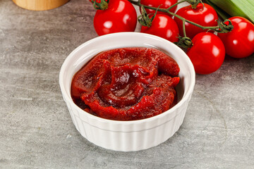 Red tomato paste in the bowl