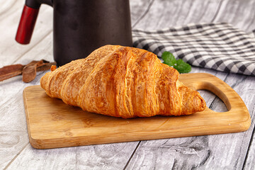 Fresh hot homemade croissant for breakfast