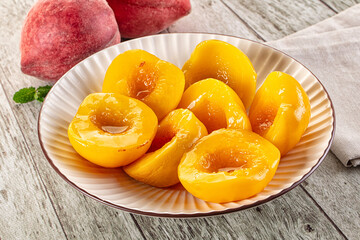Sweet ripe yellow canned peaches