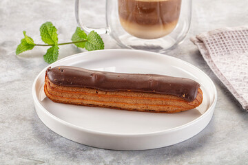 Gourmet chocolate eclair with icing