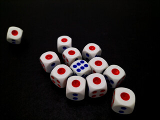dice scattered on a black surface