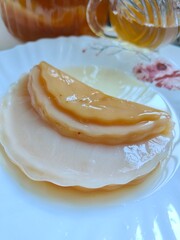Kombucha tea in a glass jar.  SCOBY or Symbiotic Culture of Bacteria and Yeast. Symbiotic fermentation culture used in the production of kombucha.