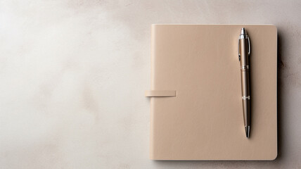 blank notepad with pen on a black table