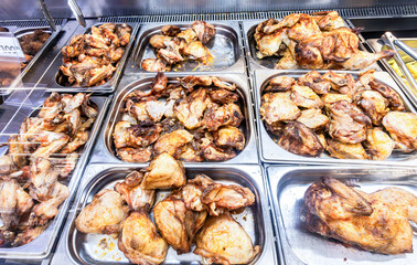Showcase with tasty fried chicken meat