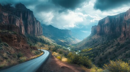 Winding road through autumn canyon, dramatic clouds. Landscapes