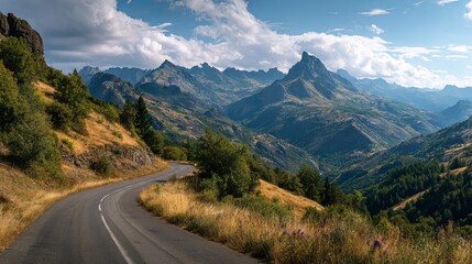 Naklejka premium Scenic Winding Road Mountain Landscape Summer Travel Photography Breathtaking View Nature Scenery Picturesque Hills Asphalt Road Trip Sky 