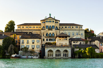Exterior face of buildings of San Giulio Island on Lake Orta in a springtime, april 2025, Piedmont,...