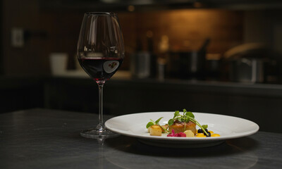 Chef Plating Gourmet Meal with Wine Pairing

