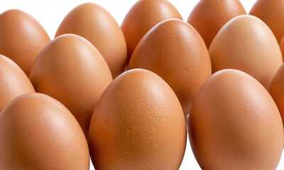 A group of brown eggs stacked on top of each other