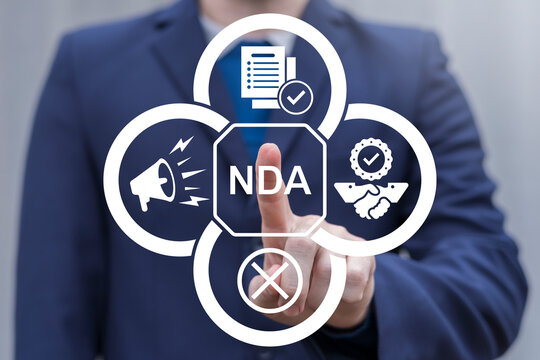 NDA or Non disclosure agreement contract concept. Person using virtual touch screen push abbreviation: NDA. Legal acknowledge signing of confidential NDA document.