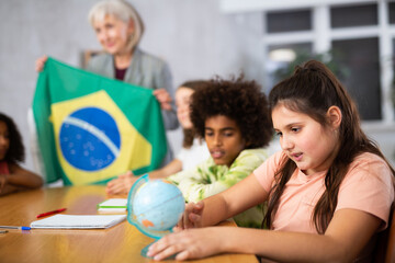 Fototapeta premium teacher is involved in lesson and conducts survey of students about nature of Brazil