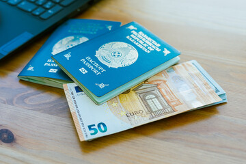 Two passports of the Republic of Kazakhstan and banknotes in denominations of euro and dollar. High quality photo