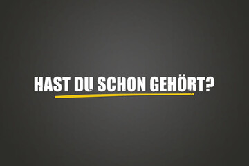 Fototapeta premium Hast Du schon gehoert (Have you already heard?) - A blackboard with white text.