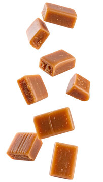 Sweet toffee candies falling on transparent background