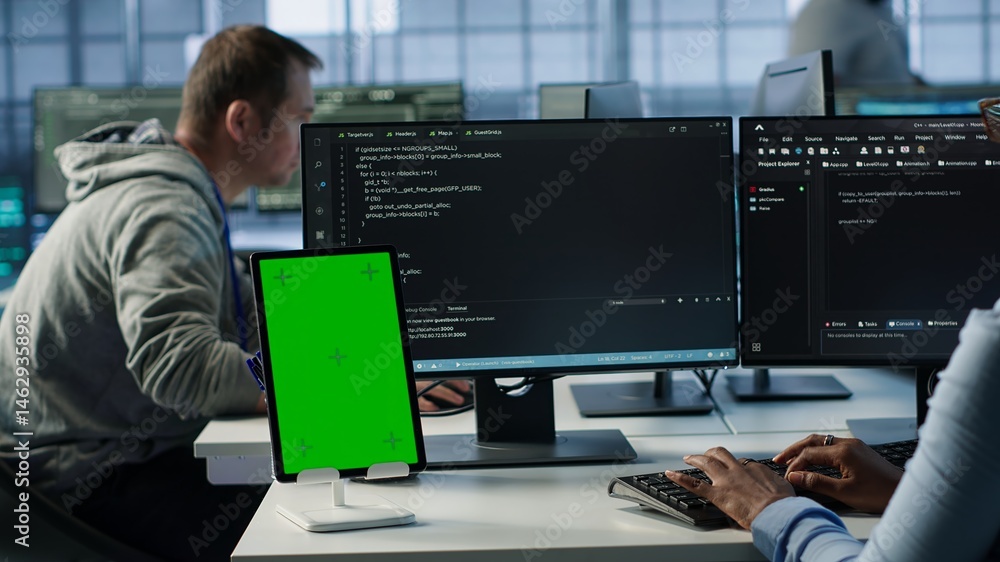 Poster green screen table in data center in front of it support specialists working together, supervising s