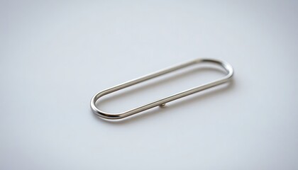 close up of a metal object on a white surface