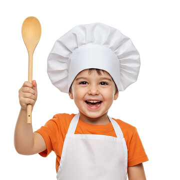A happy child dressed as a chef