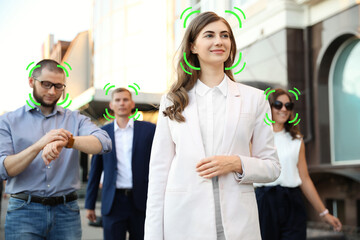 Facial recognition system identifying people on city street, selective focus