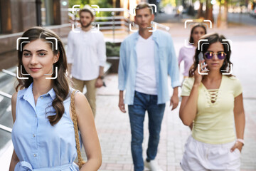 Facial recognition system identifying people on city street, selective focus