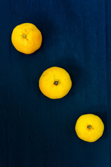 Mandarins fruit on the black background, citrus, orange, yellow, pile, 3