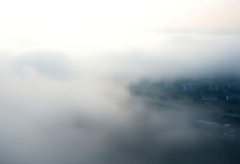 Obraz premium view of a city in the clouds from a plane