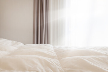 Bright Bedroom with Soft White Bedding and Curtains