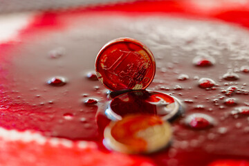  Bloody criminal finance.Bloody money background.Blood dripping on euro coins.Bloody euro money.