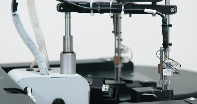 Close-up of an automatic biochemical analyzer in a modern medical laboratory. Concept integration of virology, microbiology, and biomedical engineering in high-precision diagnostics.