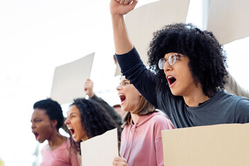 Student strike, campus strike concept. Side view of international group of students strikers with blank placards protesting on the street, fighting against corruption in school and free education