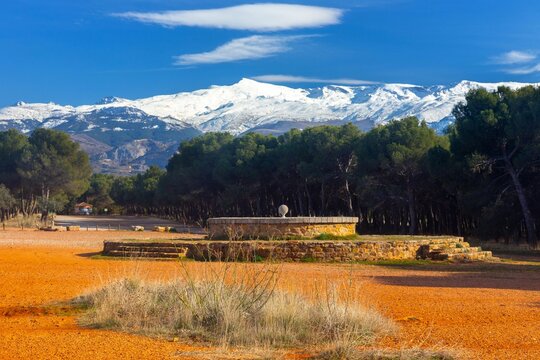 Ancient Sundial Structure, Llano de Perdiz Recreational Urban Park Area above Granada Spain. Scenic Snowy Andalucian Sierra Nevada Mountains Landscape