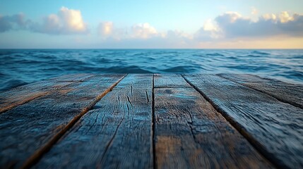 Wooden pier leading to wavy ocean under a cloudy sky