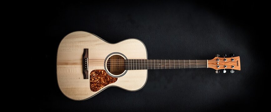 Acoustic guitar on black background. Wooden instrument with intricate detailing, including strings and soundhole