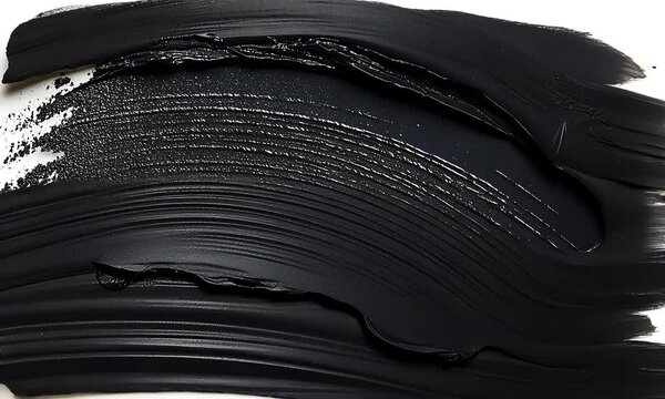 Dark, smudged black cosmetic strokes on white background.  Detailed texture visible