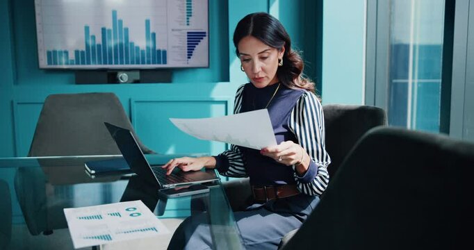 Laptop, documents and business woman with statistics for finance review, research and analytics. Office, corporate and person with charts, graph and report for financial planning, project and budget