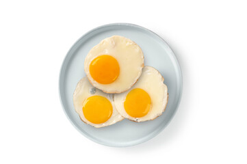 Fried egg on ceramic plate on white background. Top view