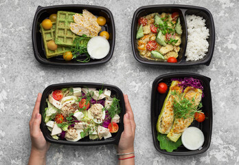 Plastic containers with delicious take away food on gray background, top view