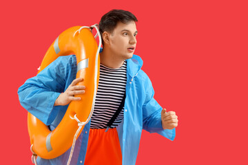 Running sailor with rescue ring on red background